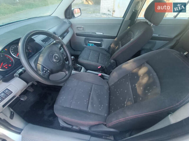 Сірий Мазда 2, об'ємом двигуна 1.4 л та пробігом 245 тис. км за 1399 $, фото 6 на Automoto.ua