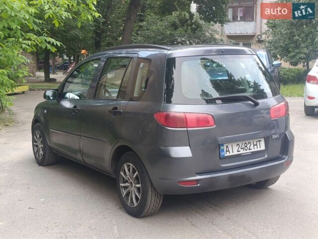 Сірий Мазда 2, об'ємом двигуна 1.4 л та пробігом 329 тис. км за 2500 $, фото 4 на Automoto.ua
