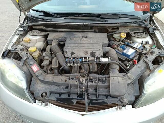 Сірий Мазда 2, об'ємом двигуна 1.2 л та пробігом 267 тис. км за 2500 $, фото 3 на Automoto.ua