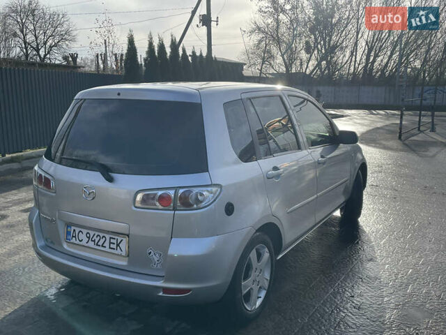 Сірий Мазда 2, об'ємом двигуна 1.39 л та пробігом 300 тис. км за 4100 $, фото 3 на Automoto.ua