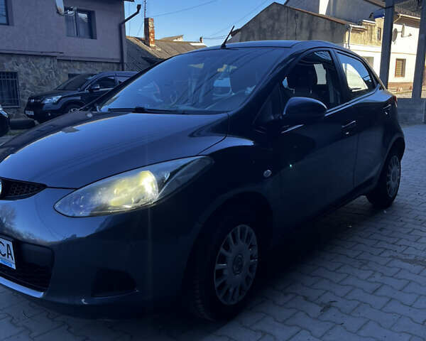 Серый Мазда 2, объемом двигателя 1.6 л и пробегом 116 тыс. км за 9300 $, фото 1 на Automoto.ua