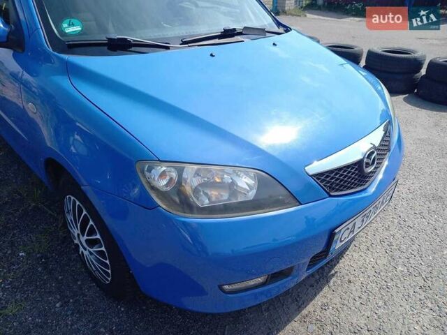 Синий Мазда 2, объемом двигателя 1.4 л и пробегом 133 тыс. км за 4150 $, фото 2 на Automoto.ua