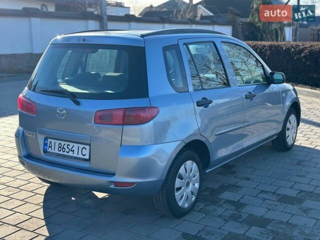 Синий Мазда 2, объемом двигателя 1.4 л и пробегом 90 тыс. км за 4200 $, фото 6 на Automoto.ua