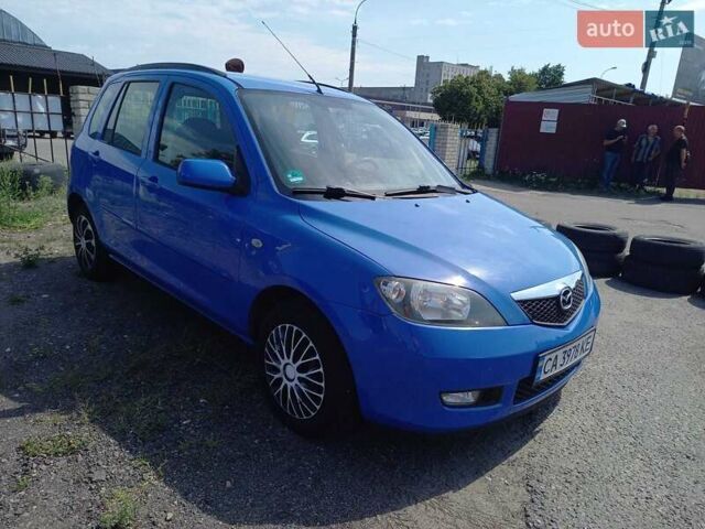 Синий Мазда 2, объемом двигателя 1.4 л и пробегом 133 тыс. км за 4150 $, фото 1 на Automoto.ua