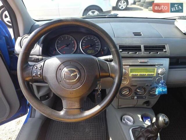 Синий Мазда 2, объемом двигателя 1.4 л и пробегом 133 тыс. км за 4150 $, фото 26 на Automoto.ua