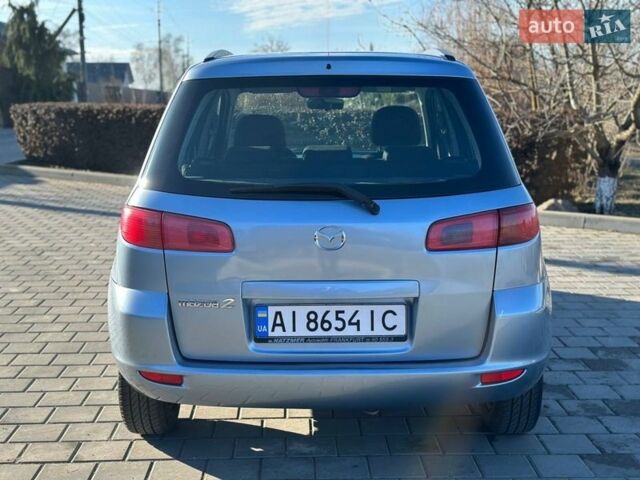 Синий Мазда 2, объемом двигателя 1.4 л и пробегом 90 тыс. км за 4200 $, фото 8 на Automoto.ua