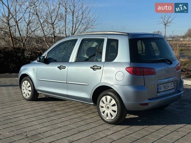 Синий Мазда 2, объемом двигателя 1.4 л и пробегом 90 тыс. км за 4200 $, фото 5 на Automoto.ua