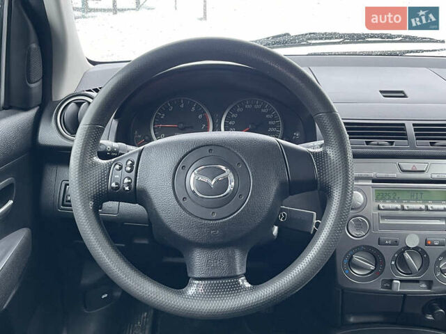 Синій Мазда 2, об'ємом двигуна 1.4 л та пробігом 178 тис. км за 3999 $, фото 28 на Automoto.ua