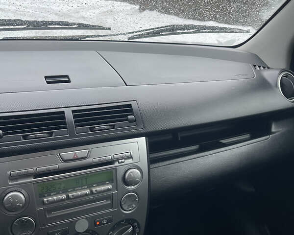 Синій Мазда 2, об'ємом двигуна 1.4 л та пробігом 178 тис. км за 3999 $, фото 29 на Automoto.ua