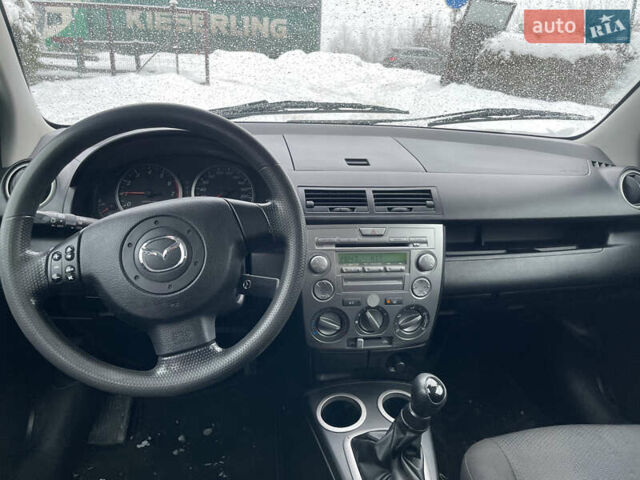 Синій Мазда 2, об'ємом двигуна 1.4 л та пробігом 178 тис. км за 3999 $, фото 23 на Automoto.ua