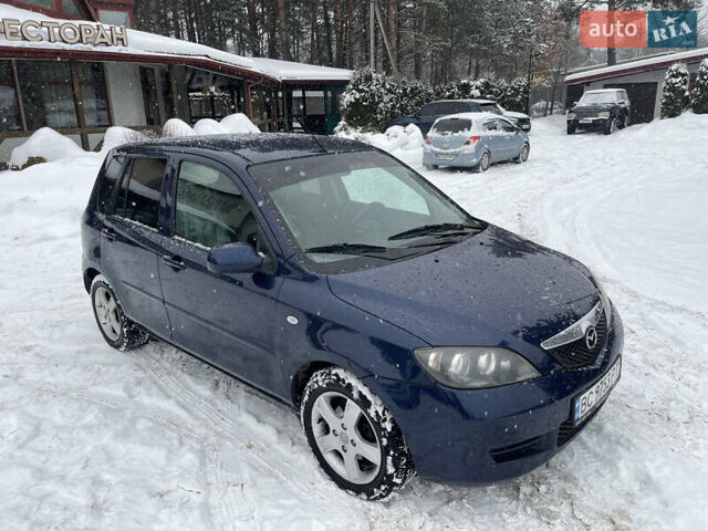 Синій Мазда 2, об'ємом двигуна 1.4 л та пробігом 178 тис. км за 3999 $, фото 1 на Automoto.ua
