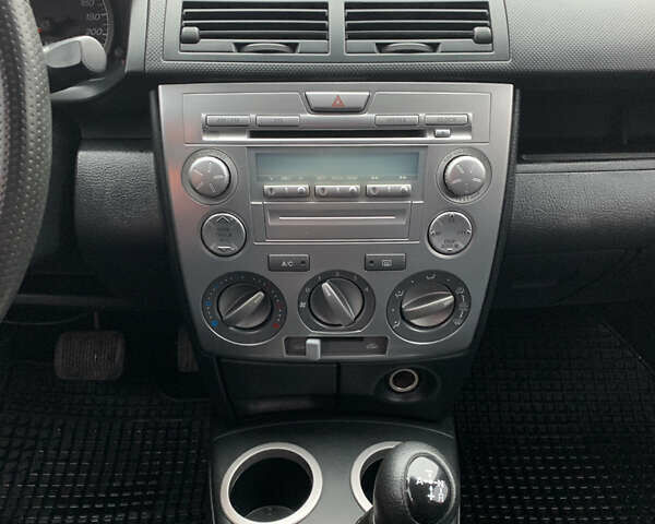 Синий Мазда 2, объемом двигателя 1.4 л и пробегом 185 тыс. км за 5700 $, фото 15 на Automoto.ua