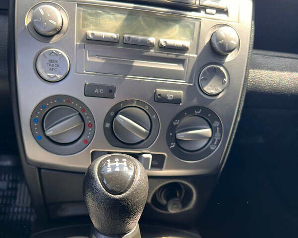 Синий Мазда 2, объемом двигателя 1.4 л и пробегом 179 тыс. км за 3499 $, фото 14 на Automoto.ua