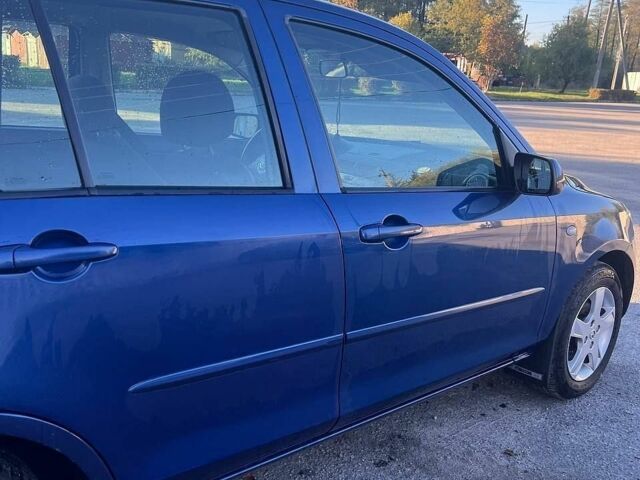 Синий Мазда 2, объемом двигателя 1.39 л и пробегом 207 тыс. км за 3200 $, фото 5 на Automoto.ua