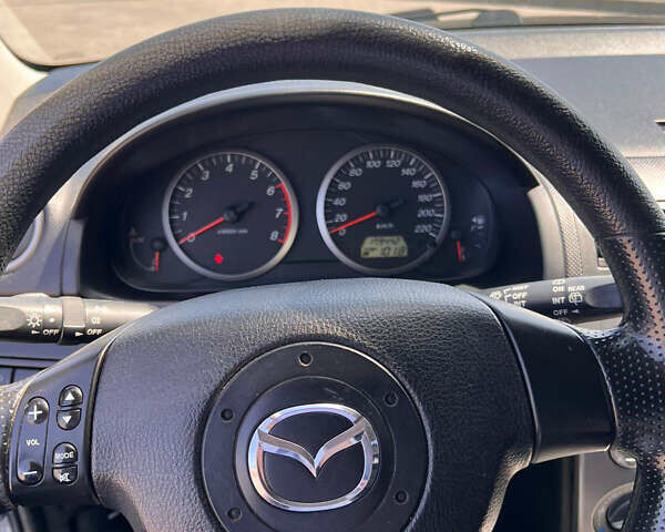 Синий Мазда 2, объемом двигателя 1.4 л и пробегом 179 тыс. км за 3499 $, фото 13 на Automoto.ua