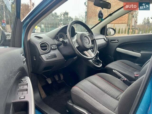 Синій Мазда 2, об'ємом двигуна 1.35 л та пробігом 271 тис. км за 5450 $, фото 22 на Automoto.ua