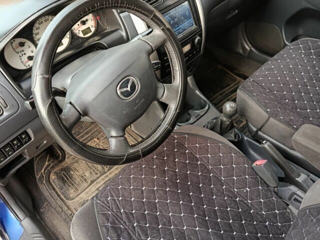 Синий Мазда 2, объемом двигателя 1.8 л и пробегом 318 тыс. км за 3000 $, фото 7 на Automoto.ua
