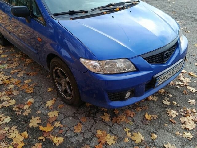 Синий Мазда 2, объемом двигателя 1.8 л и пробегом 318 тыс. км за 3000 $, фото 6 на Automoto.ua