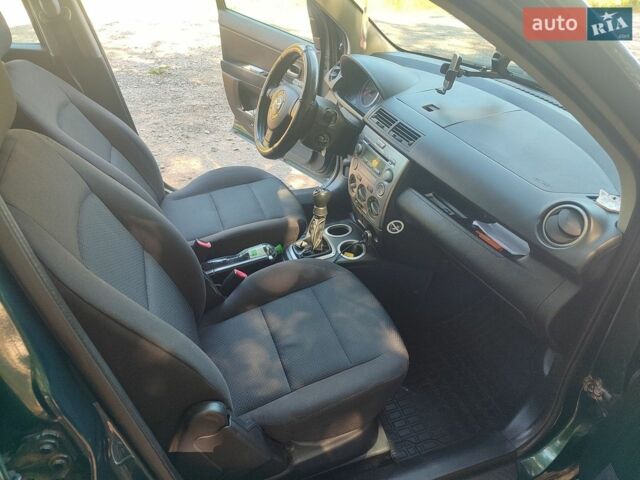 Зелений Мазда 2, об'ємом двигуна 1.4 л та пробігом 204 тис. км за 3800 $, фото 14 на Automoto.ua