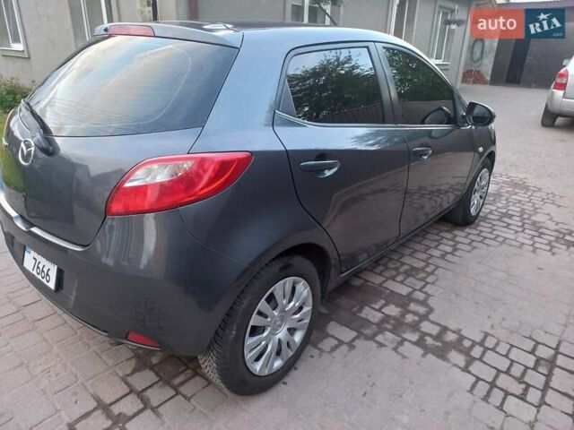 Зелений Мазда 2, об'ємом двигуна 1.4 л та пробігом 181 тис. км за 4800 $, фото 5 на Automoto.ua