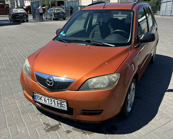 Оранжевый Мазда 2, объемом двигателя 1.4 л и пробегом 222 тыс. км за 3500 $, фото 7 на Automoto.ua