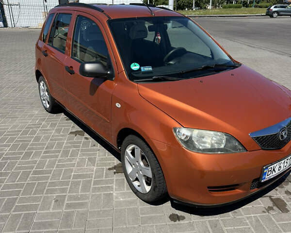 Оранжевый Мазда 2, объемом двигателя 1.4 л и пробегом 222 тыс. км за 3500 $, фото 14 на Automoto.ua
