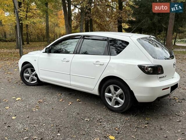 Белый Мазда 3, объемом двигателя 1.59 л и пробегом 305 тыс. км за 4900 $, фото 26 на Automoto.ua