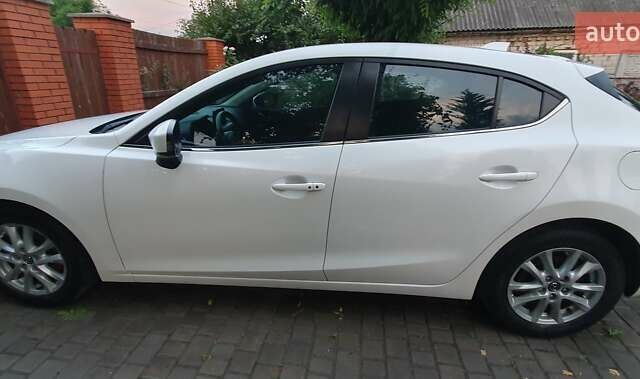 Белый Мазда 3, объемом двигателя 2 л и пробегом 169 тыс. км за 9400 $, фото 4 на Automoto.ua