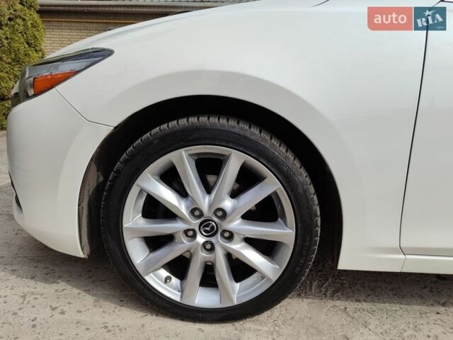Білий Мазда 3, об'ємом двигуна 2.49 л та пробігом 105 тис. км за 13000 $, фото 26 на Automoto.ua
