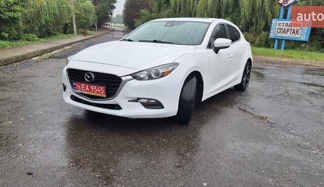 Білий Мазда 3, об'ємом двигуна 2.5 л та пробігом 95 тис. км за 11300 $, фото 4 на Automoto.ua