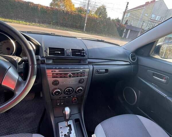 Білий Мазда 3, об'ємом двигуна 1.6 л та пробігом 190 тис. км за 6100 $, фото 5 на Automoto.ua
