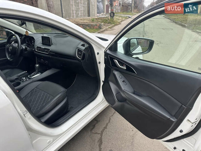 Белый Мазда 3, объемом двигателя 2 л и пробегом 173 тыс. км за 8700 $, фото 16 на Automoto.ua