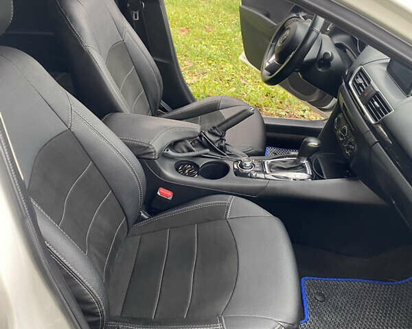 Білий Мазда 3, об'ємом двигуна 2 л та пробігом 175 тис. км за 9000 $, фото 16 на Automoto.ua