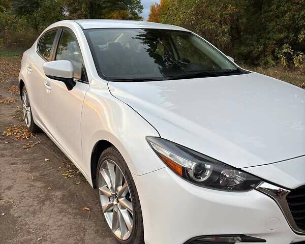 Белый Мазда 3, объемом двигателя 2 л и пробегом 143 тыс. км за 12900 $, фото 4 на Automoto.ua