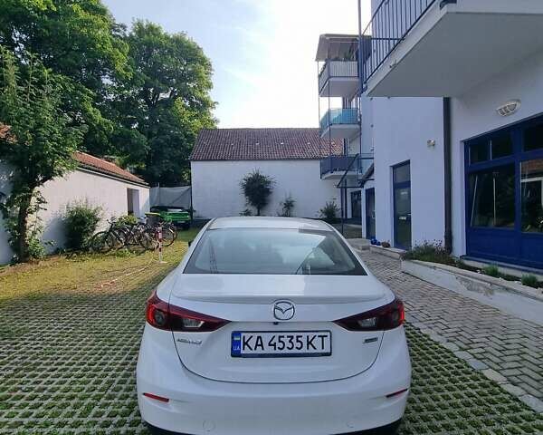 Белый Мазда 3, объемом двигателя 1.5 л и пробегом 98 тыс. км за 14029 $, фото 1 на Automoto.ua