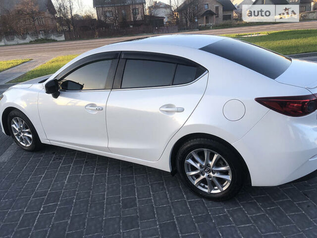 Белый Мазда 3, объемом двигателя 2 л и пробегом 118 тыс. км за 11000 $, фото 5 на Automoto.ua