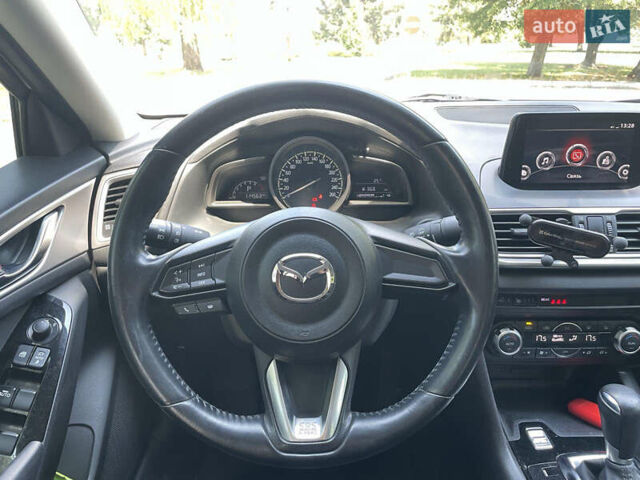 Білий Мазда 3, об'ємом двигуна 1.6 л та пробігом 116 тис. км за 13000 $, фото 13 на Automoto.ua