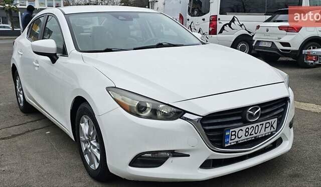 Белый Мазда 3, объемом двигателя 2 л и пробегом 130 тыс. км за 9900 $, фото 3 на Automoto.ua