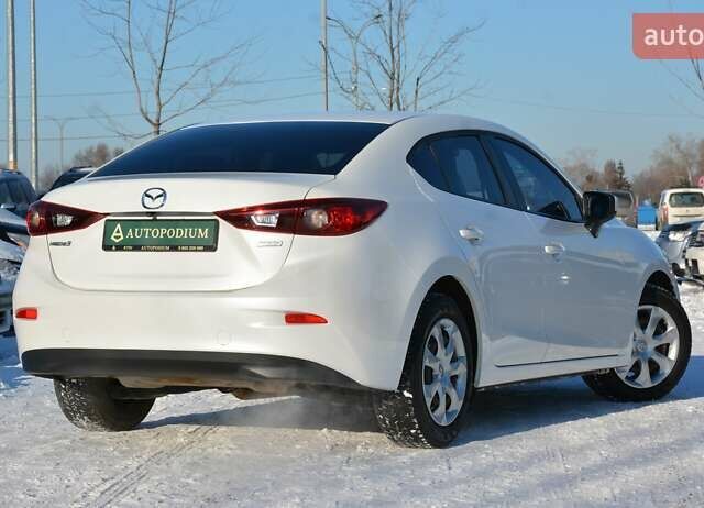 Білий Мазда 3, об'ємом двигуна 2 л та пробігом 90 тис. км за 12700 $, фото 11 на Automoto.ua