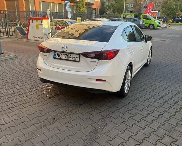 Белый Мазда 3, объемом двигателя 2 л и пробегом 109 тыс. км за 11800 $, фото 10 на Automoto.ua