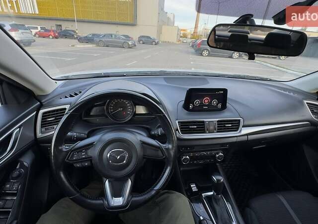 Білий Мазда 3, об'ємом двигуна 1.5 л та пробігом 144 тис. км за 13500 $, фото 9 на Automoto.ua