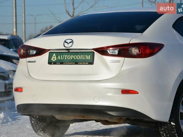 Білий Мазда 3, об'ємом двигуна 2 л та пробігом 90 тис. км за 12700 $, фото 9 на Automoto.ua