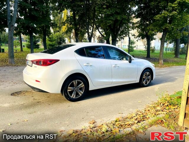 Белый Мазда 3, объемом двигателя 2 л и пробегом 139 тыс. км за 11950 $, фото 2 на Automoto.ua