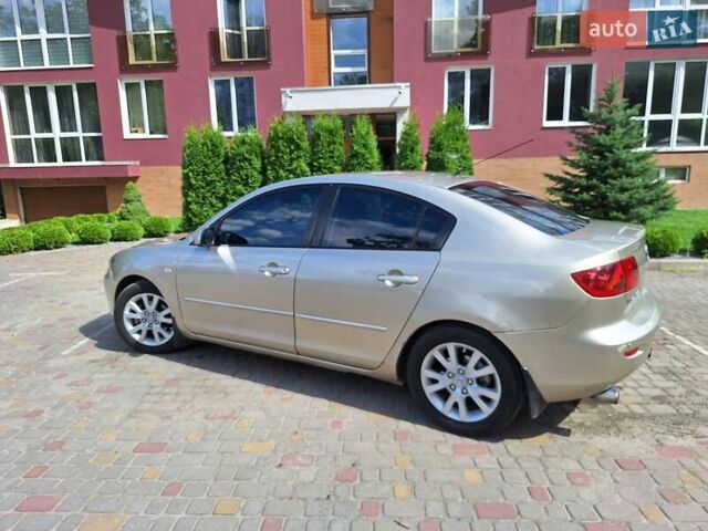 Бежевий Мазда 3, об'ємом двигуна 1.6 л та пробігом 247 тис. км за 5300 $, фото 12 на Automoto.ua