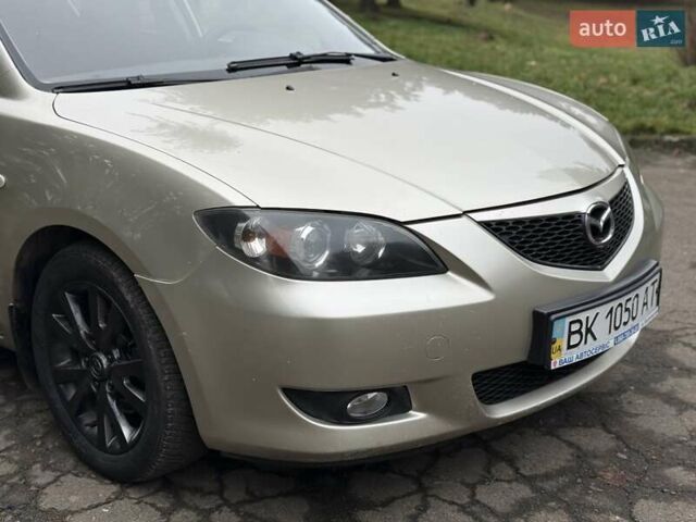 Бежевый Мазда 3, объемом двигателя 1.6 л и пробегом 220 тыс. км за 3499 $, фото 16 на Automoto.ua