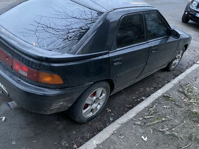 Черный Мазда 3, объемом двигателя 1.8 л и пробегом 313 тыс. км за 674 $, фото 3 на Automoto.ua