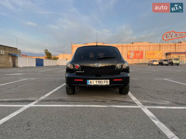 Черный Мазда 3, объемом двигателя 2 л и пробегом 215 тыс. км за 4050 $, фото 5 на Automoto.ua