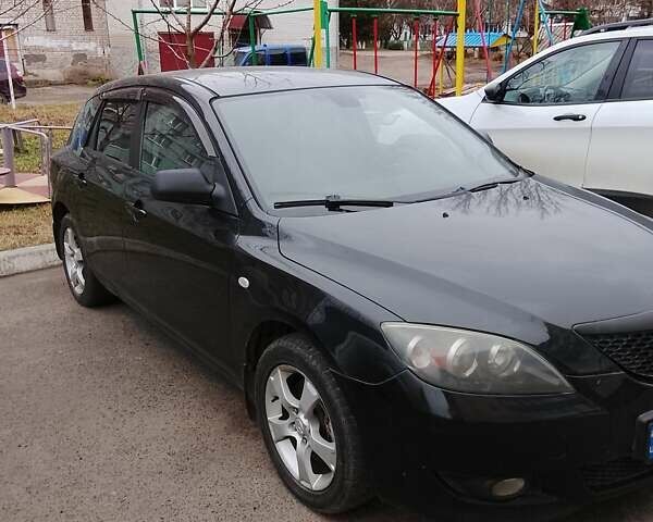 Черный Мазда 3, объемом двигателя 2 л и пробегом 182 тыс. км за 4800 $, фото 1 на Automoto.ua