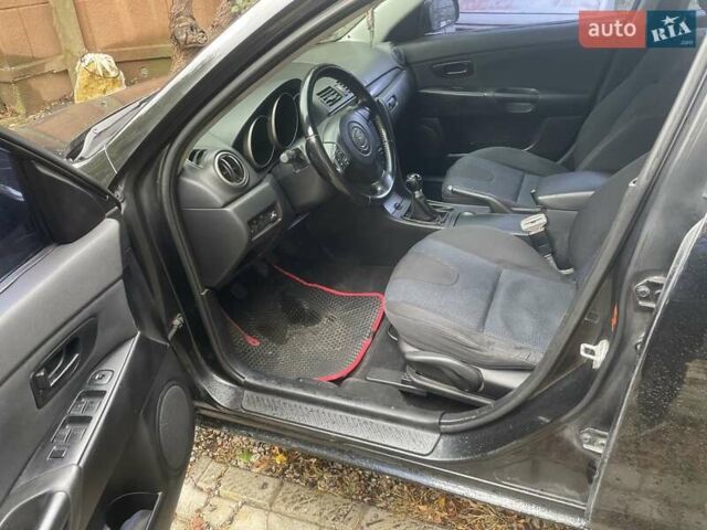 Чорний Мазда 3, об'ємом двигуна 2 л та пробігом 274 тис. км за 4200 $, фото 15 на Automoto.ua