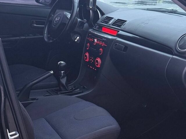 Черный Мазда 3, объемом двигателя 1.6 л и пробегом 300 тыс. км за 4000 $, фото 5 на Automoto.ua